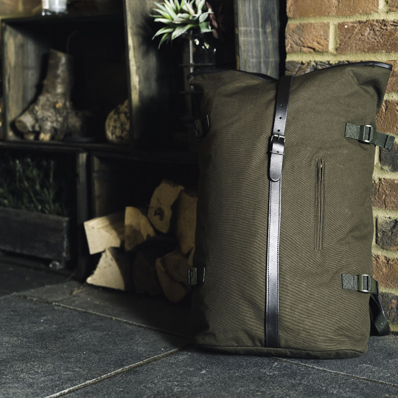 green heavy cotton canvas roll top adventure rucksack lifestyle 3